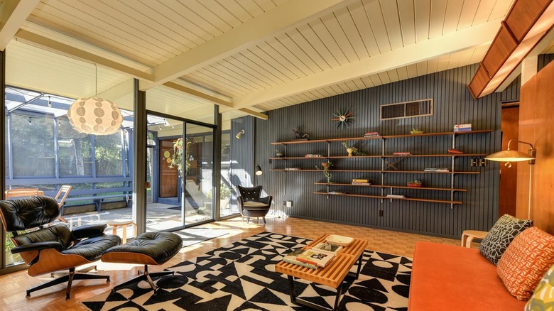 A living decorated with midcentury modern furniture and accents.