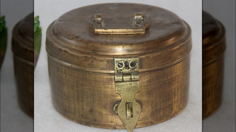 A brass chapati box.