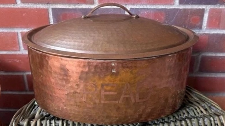A worn Williams-Sonoma copper breadbox.