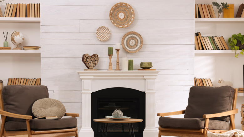Modern white mantel with wood accented mantel decor