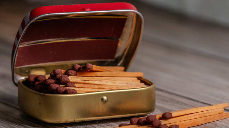 Red and gold matchbox holder