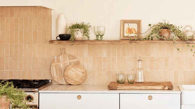 A raw Moroccan tile backsplash is shown in a modern kitchen