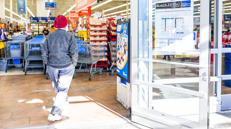 Man in red turban walking into Walmart