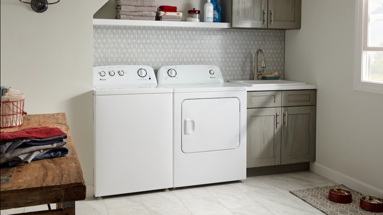A white washer and dryer unit partially hidden behind an alcove