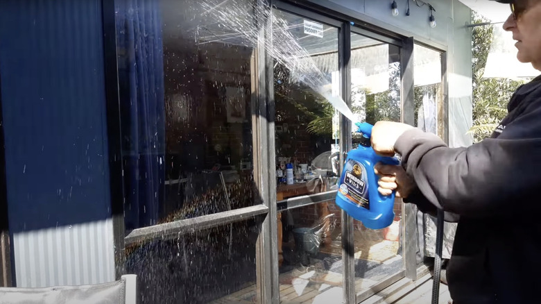 Man using a window witch product