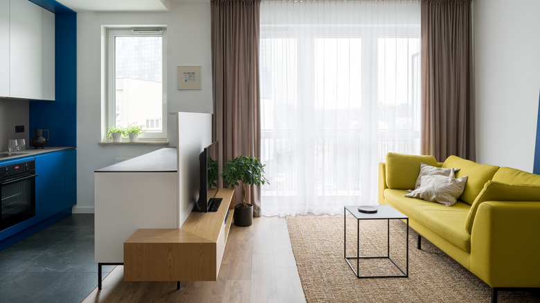 Living room with yellow sofa 