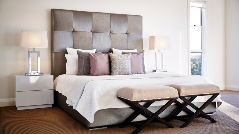 Bedroom with upholstered gray bed