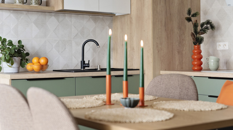 Taper candles on a kitchen table