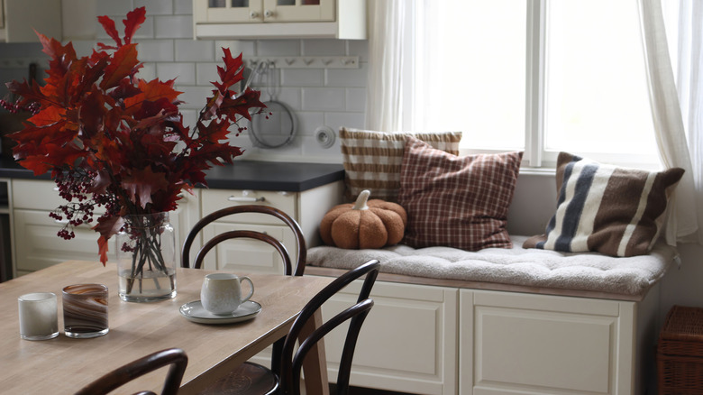 A cozy kitchen nook with throw pillows
