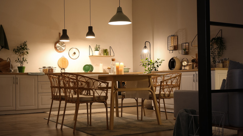Cozy lights hanging above and on counters beside kitchen table