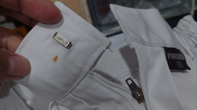 A rust stain on white pants