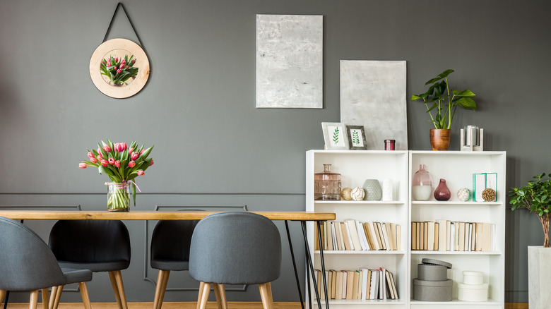 Artwork and books on bookshelf 