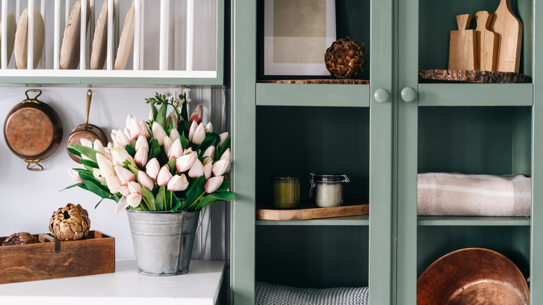 Farmhouse sage green glass cabinets