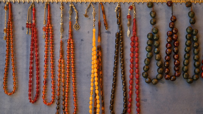 Close up of jewelry hanging on hooks