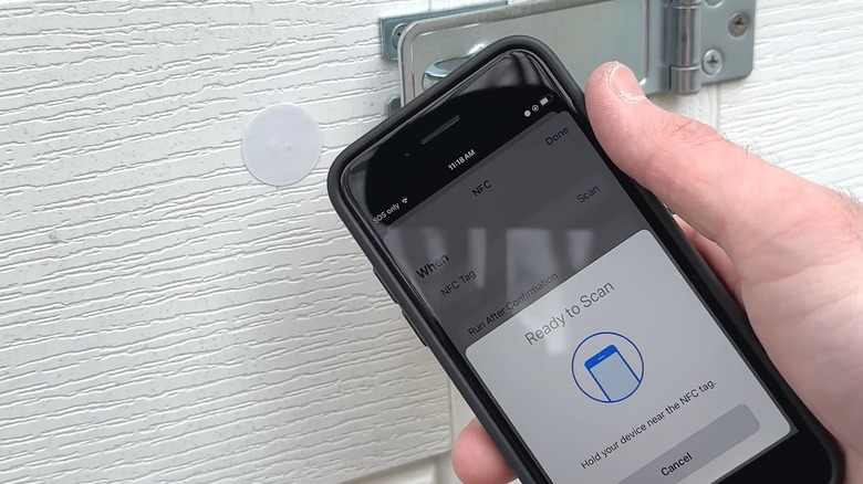 Closeup of a phone tapping an NFC tag