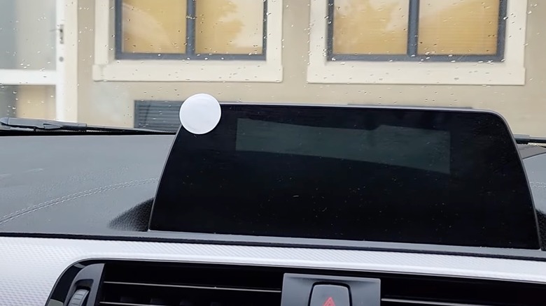 An NFC tag inside a car's GPS panel
