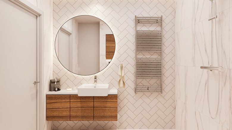 white tile wall in bathroom