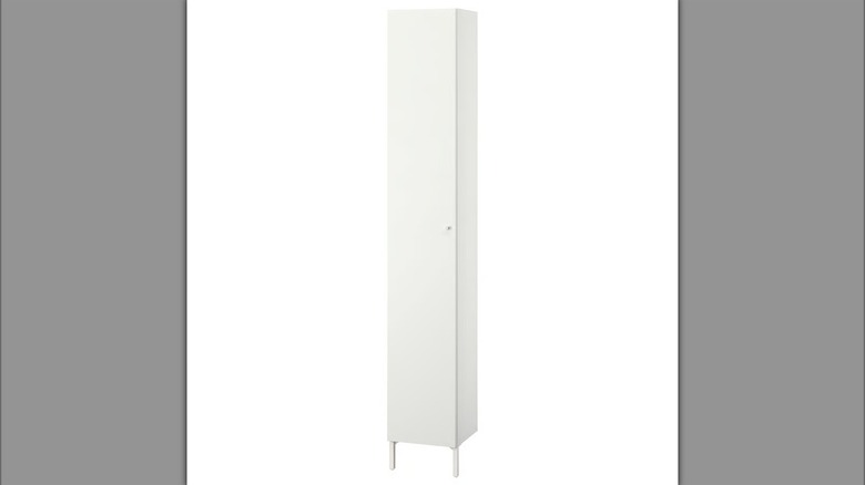 Long white cabinet with bathroom toiletries