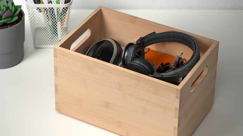 Tan coloured box holding black tea pouches