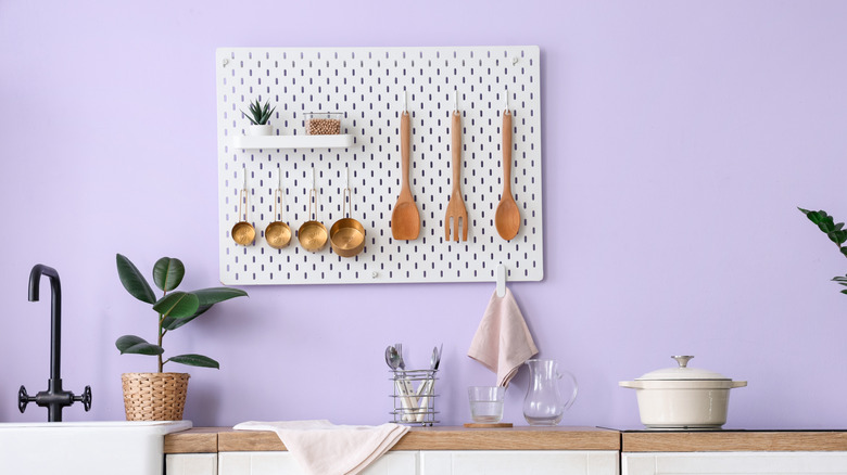 Kitchen with hanging pegboard organizer