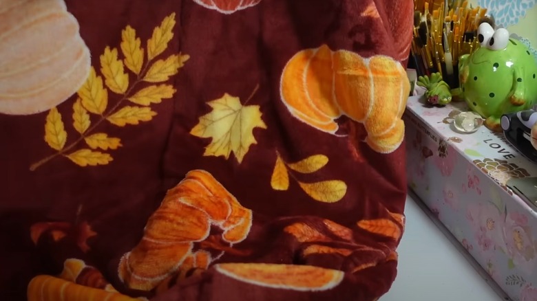 Blanket with pumpkins and leaves