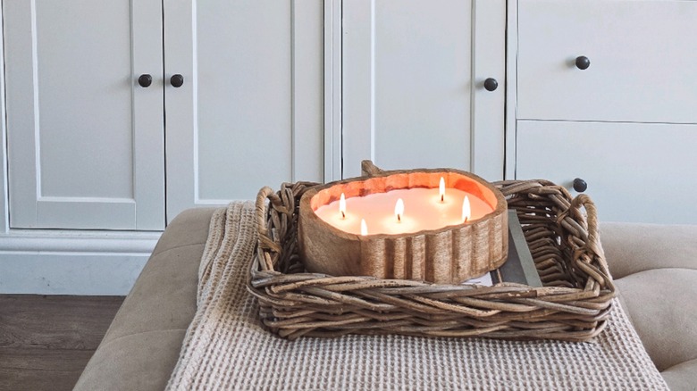 Pumpkin shaped candle in living room