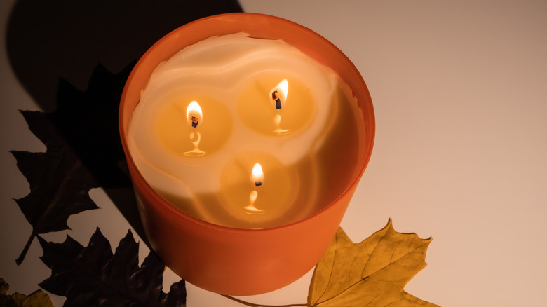 Orange three wick candle