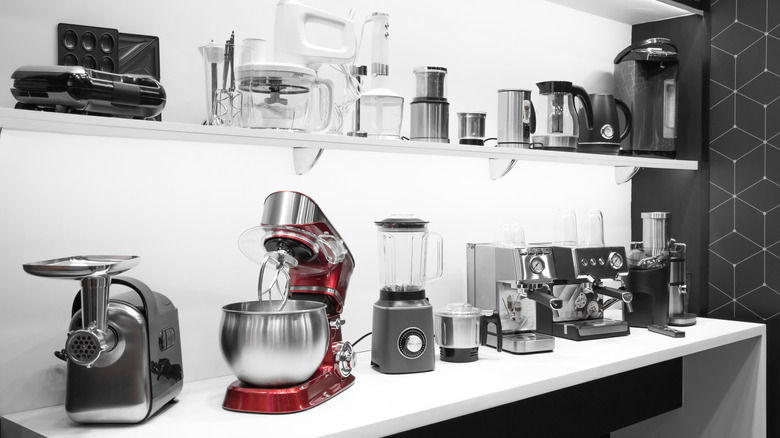 An array of kitchen appliances stored on shelves