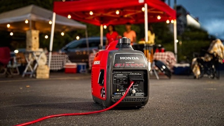 Honda 2200-Watt Portable Inverter Generator powering up a camping site