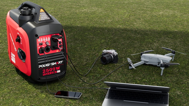 a PowerSmart 2500-Watt Portable Inverter Gas Generator charging some electronics