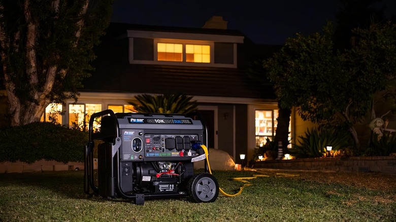 The Pulsar 10500-Watt Dual Fuel Inverter Generator powering a home at night