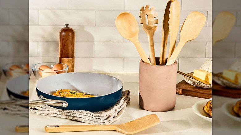 Five piece wooden cooking utensil set unpacked from box