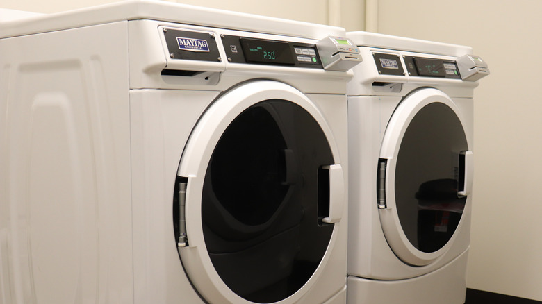 Two Maytag laundry machines in a laundry room