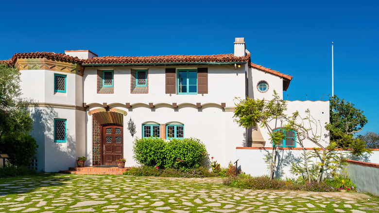 Malibu's Adamson House, Spanish-style villa with stone courtyard, in the sun.