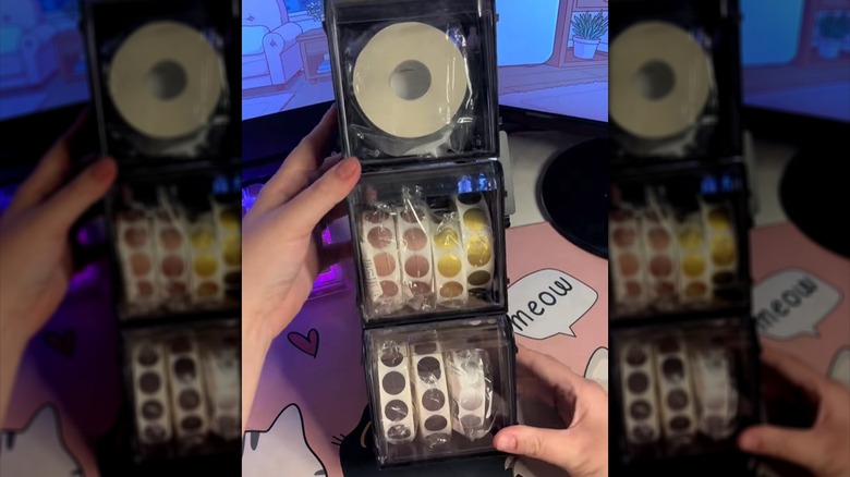 stacked tilt bins holding stickers