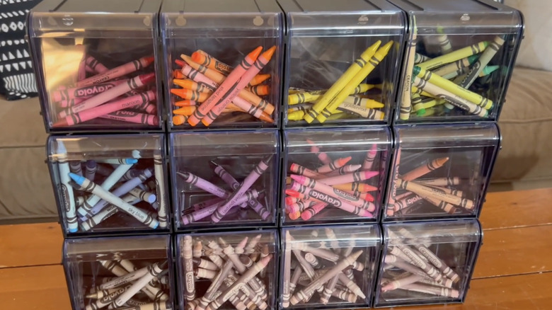 stackable tilt bins holding crayons sorted by color