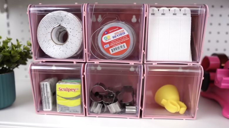 pink stackable tilt bins filled with craft supplies