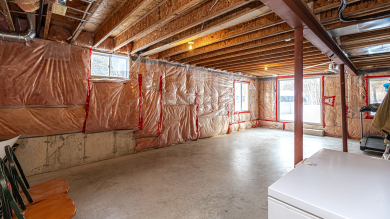 UNFINISHED BASEMENT WITH EXPOSED INSULATION