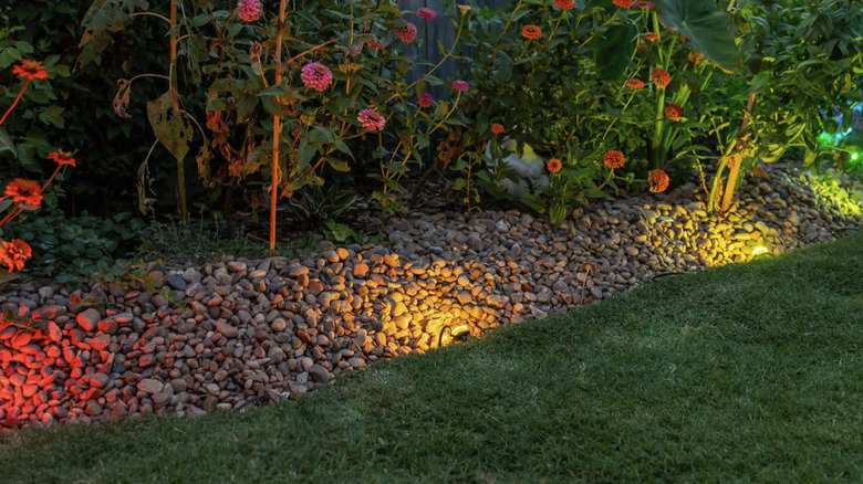 Embrighten's WiFi Eternity Outdoor Landscape Lights in an attractive garden flower bed