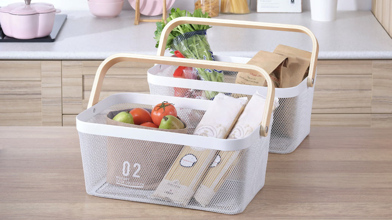Edifice's Mesh Baskets with Handles on a kitchen counter, filled with produce