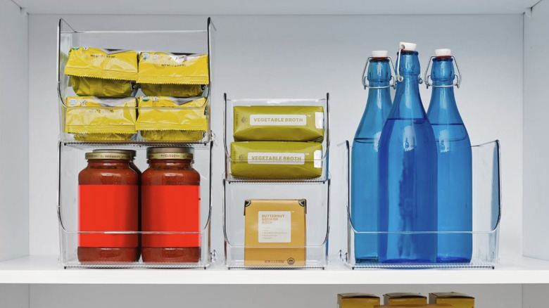 A shot of iDesign's Stacking Open Front Pantry Bins on a pantry cabinet shelf