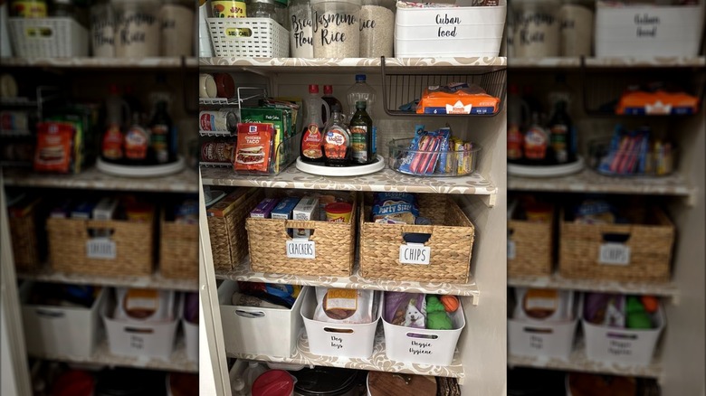 A shot showing Seville Classics' Water Hyacinth Storage Baskets used in a pantry cabinet