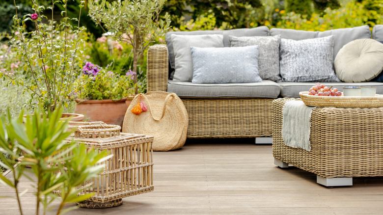 An outdoor patio with wicker furniture