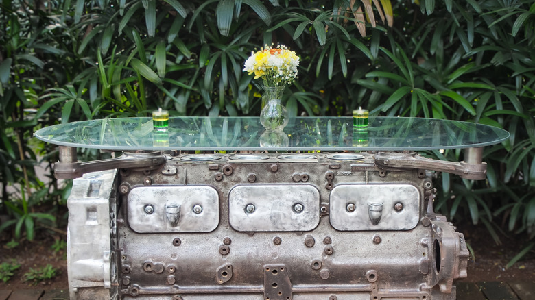 A coffee table made from a repurposed engine block.