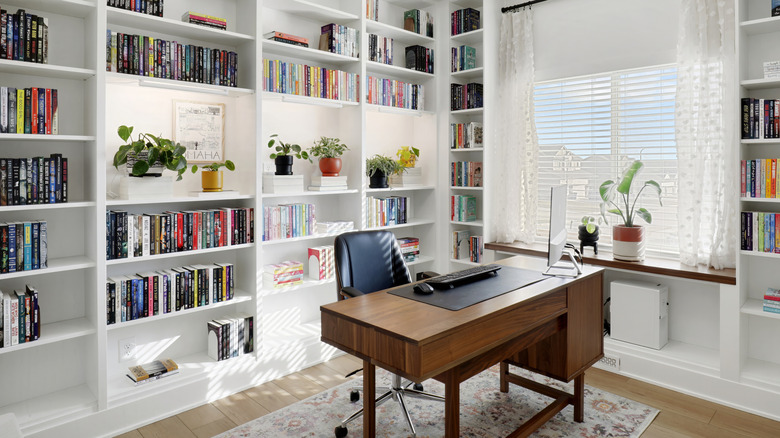 White bookshelves in home office