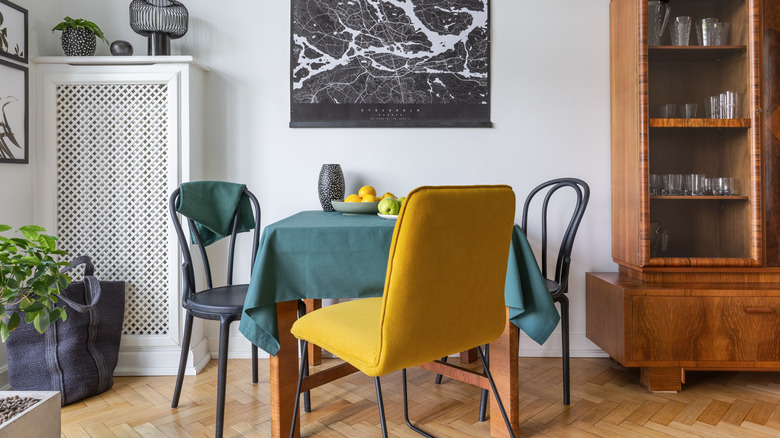 An eclectic dining room design with a mix of interesting furniture pieces