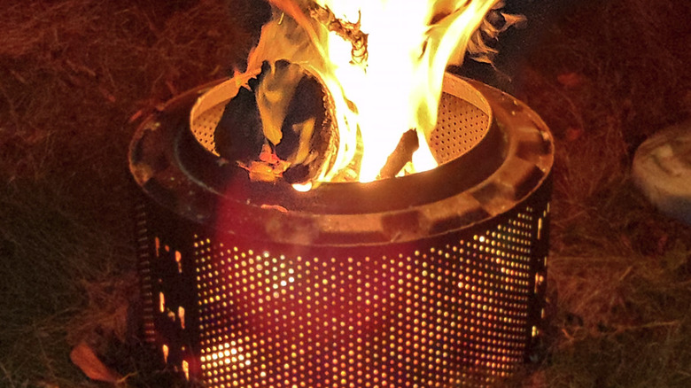 A washing machine drum used as a fire pit
