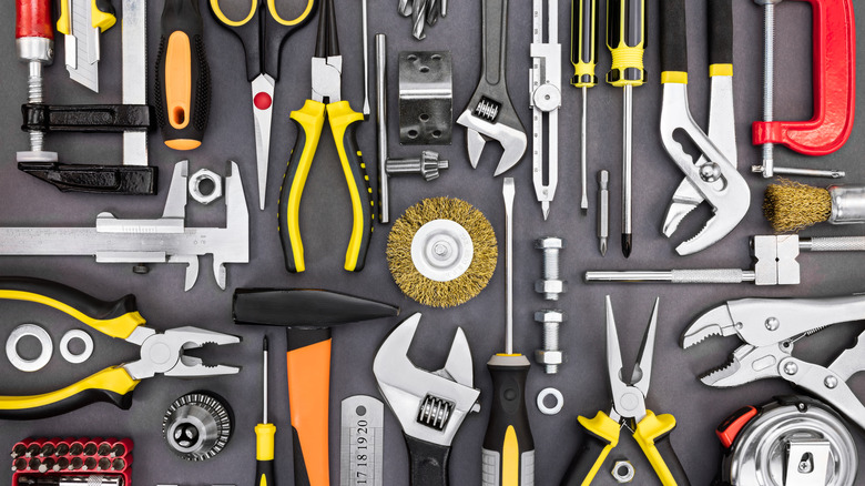 Essential tools laid out together on a black surface