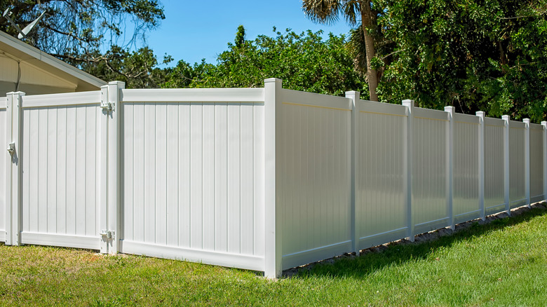 A white vinyl fence