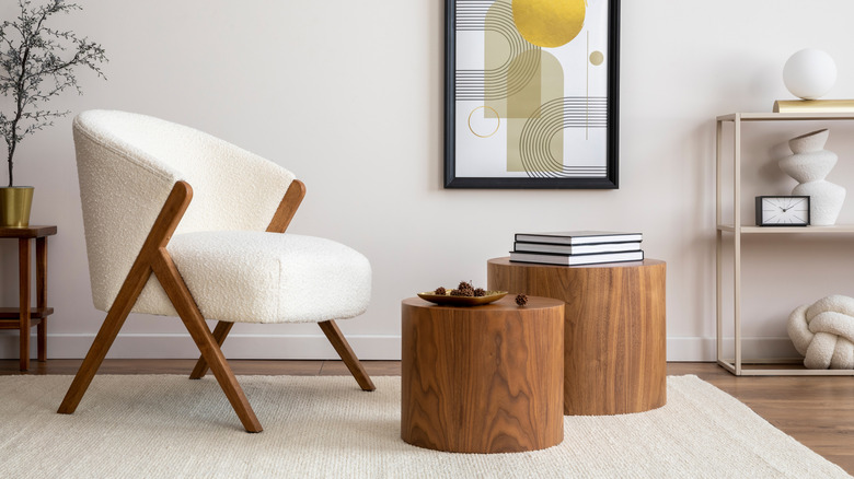 A living room with a white, textured, bouclé chair